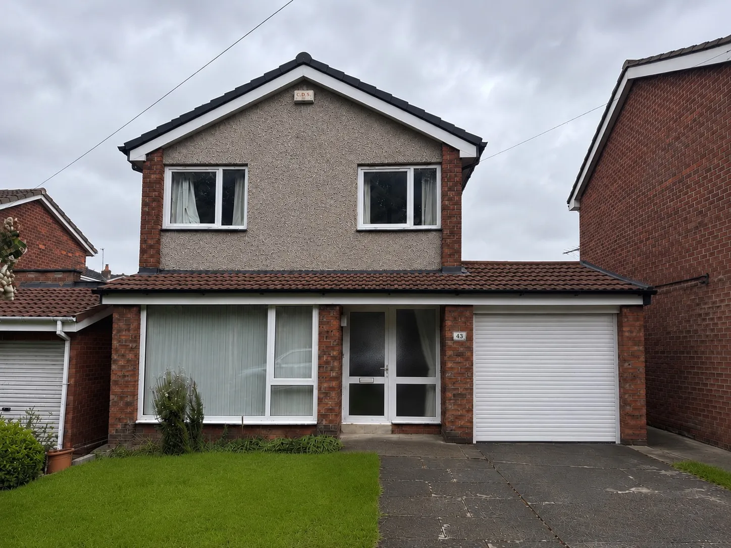 A house in Chester-le-Street with a newly pitched roof across the front canopy and garage.