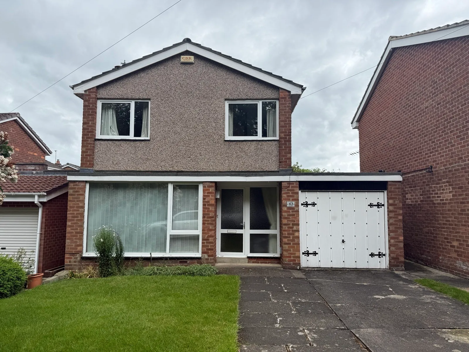 The house in Chester-le-Street before the work, showing the flat roof over the front canopy and garage.