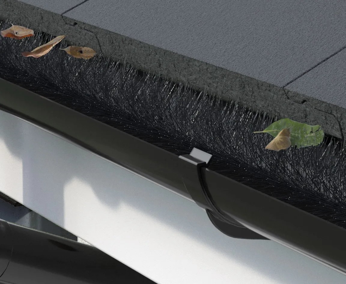 Brush-style guard filling the gutter channel with leaves held on the bristles