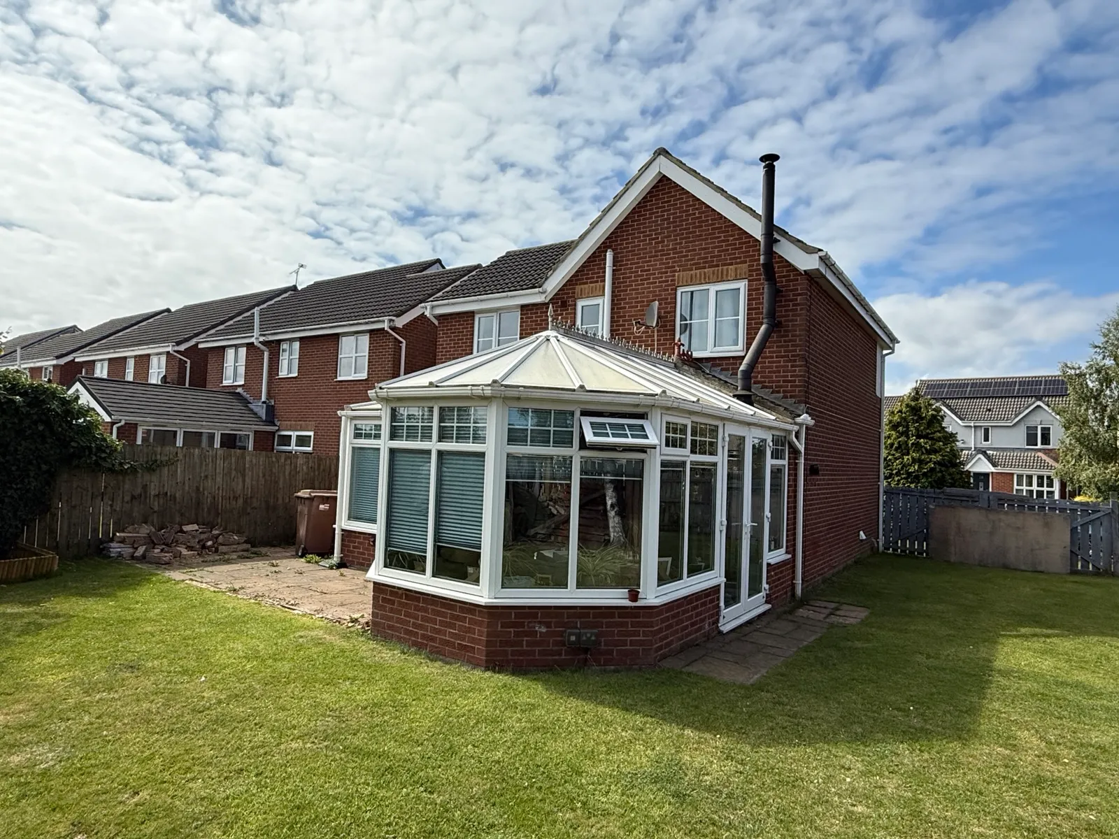 The original conservatory and adjoining house roofs.