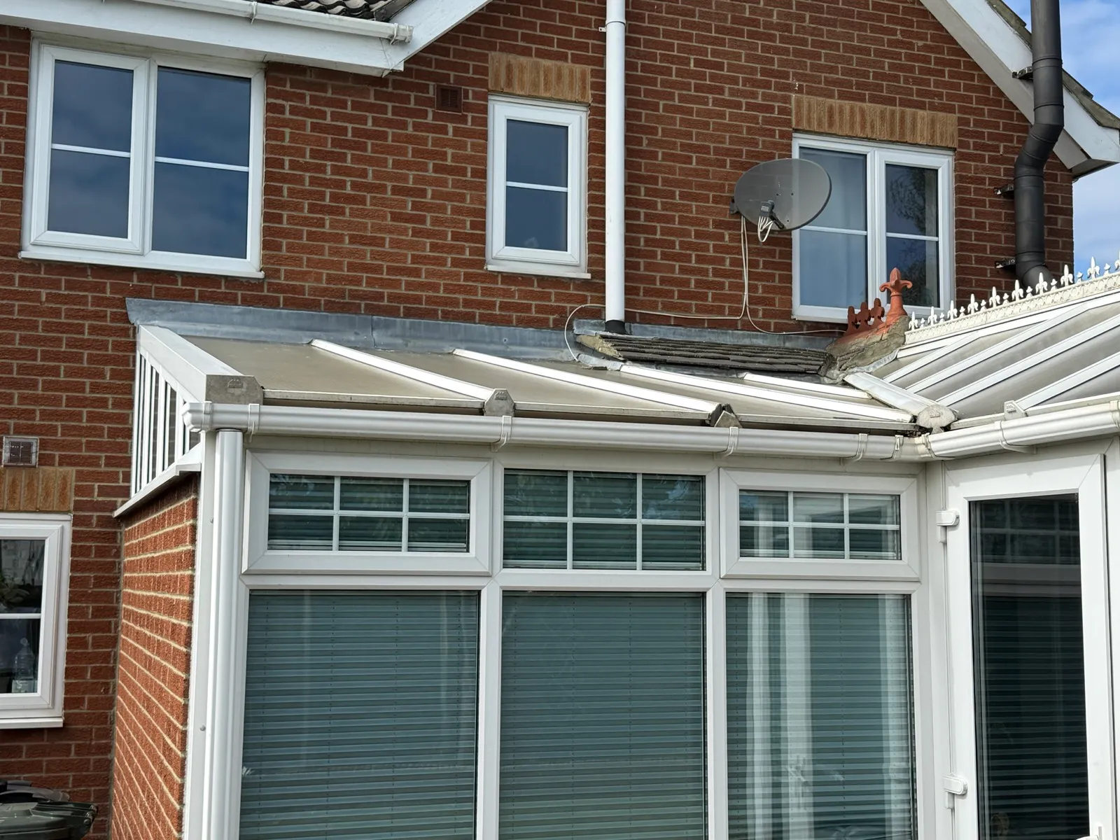Existing lean-to section and its junction with the tiled roof.