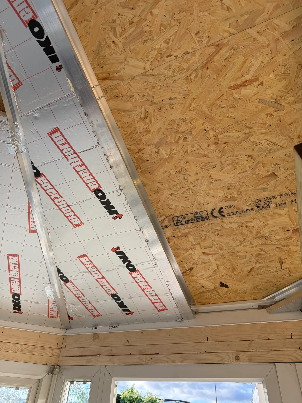 Roof boarding and insulation during installation.