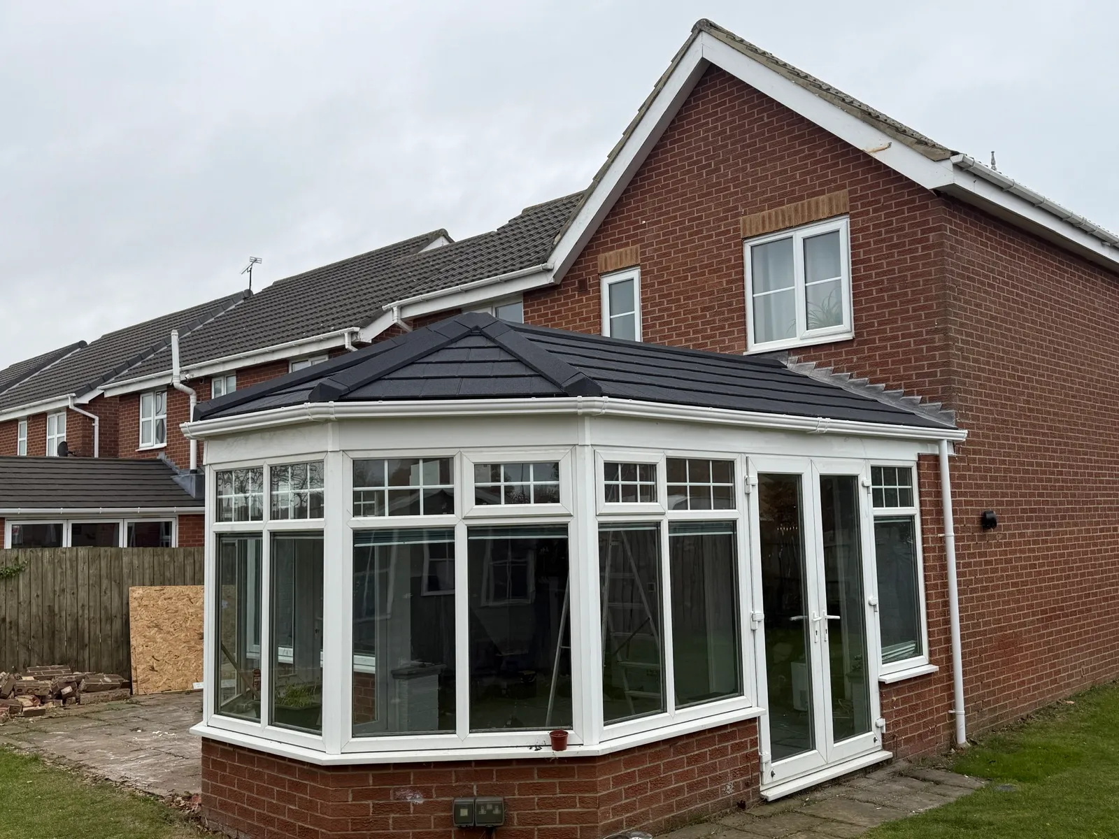 Closer view of the replacement roof and conservatory.