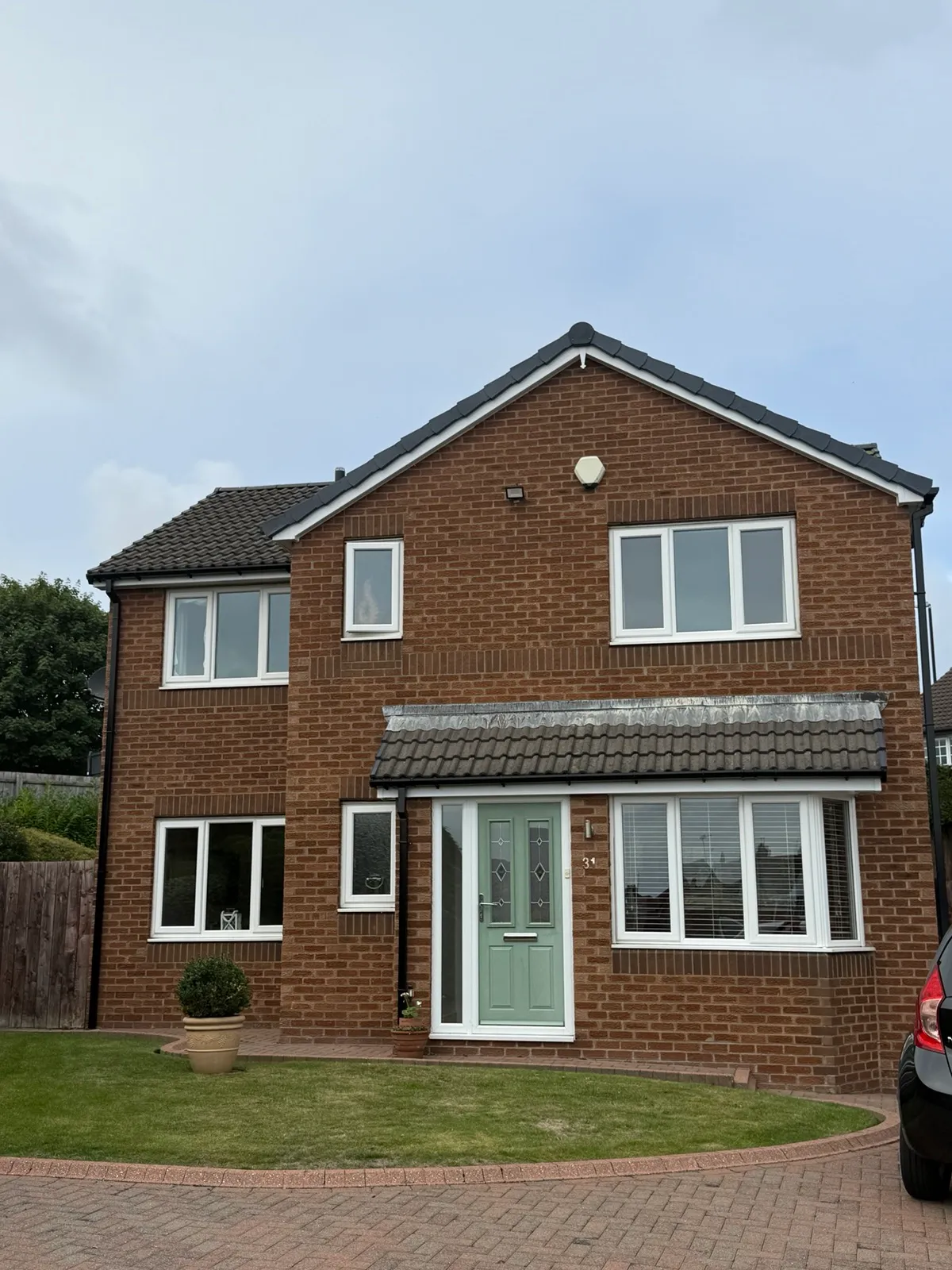 Front elevation of the two-storey Seaburn property, with white roofline, dark guttering and dry-verge edging along the gable.